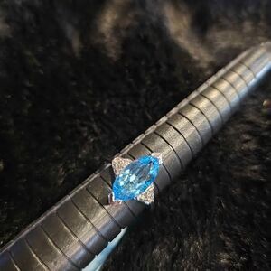 3.78CTW Swiss Blue Topaz with Moissanite accents. Size 6